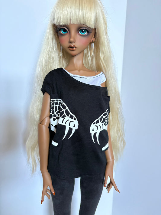 Doll wearing a 60cm/SD13 BJD Boy Double Snake Black Boxy Shirt with white snake claw designs and long blonde hair.