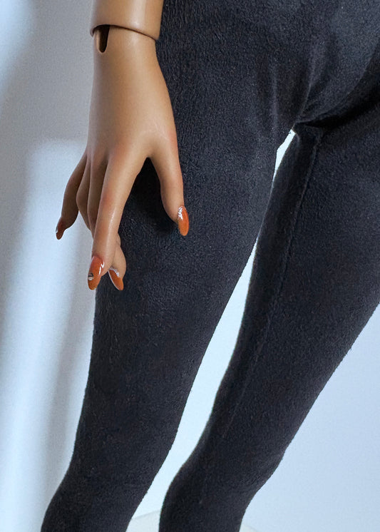 Close-up of a doll wearing 60cm/SD13 BJD Girl Grey Stretch Suede Leggings with detailed hand and nails visible