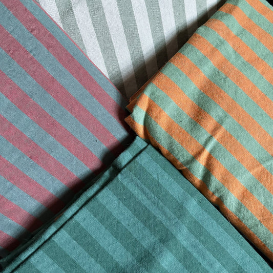 Four striped fabric swatches.