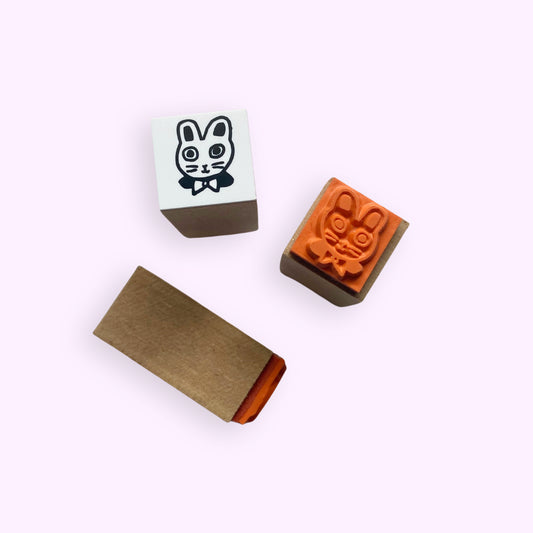 Tiny Usagi-chan Bunny Head Rubber Stamp showing the bunny face design in black ink with rubber and paper components.