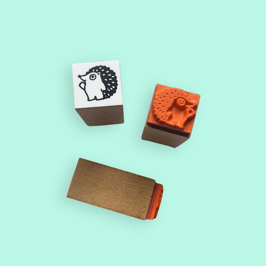 Tiny Happy Hedgehog Rubber Stamp showing cute hedgehog design on wooden block with rubber stamp detail