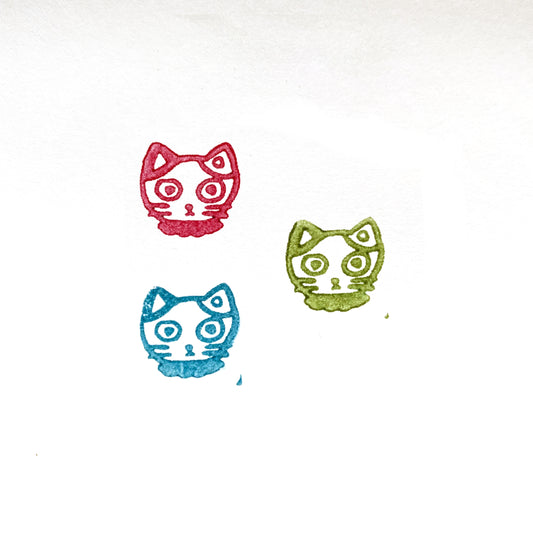 Tiny Calico Mike-chan Cat Head Rubber Stamp impressions in red, green, and blue ink on white paper.