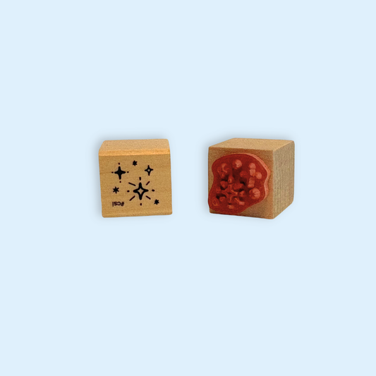 Two wooden Little Sparkling Stars Rubber Stamp blocks showing star designs and red rubber stamp surface
