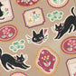 Black Cat and Flowers Sticker Sheet featuring black cat poses and decorative floral oval and square designs on neutral background
