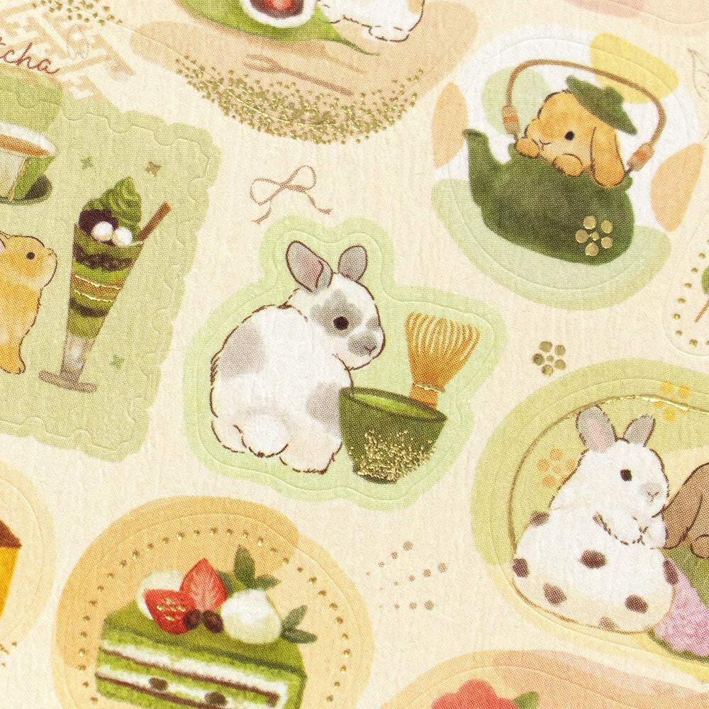 Close-up of "Bunnies & Sweets Sticker Sheet" featuring rabbits and dessert illustrations with soft pastel colors.