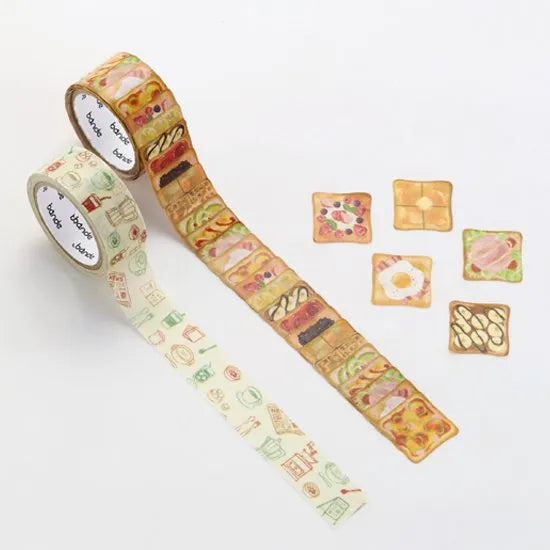 Two decorative rolls and individual pieces of Toast Breakfast Washi Sticker & Tape 2-Pack with breakfast-themed designs.