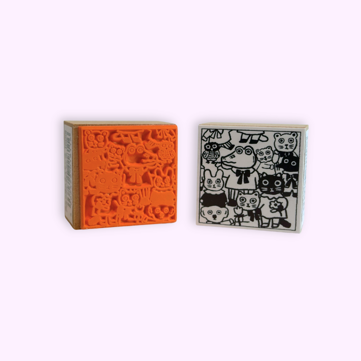 Rubber stamp with assorted animal art by artist Yumi Kitagishi. The front art and the back rubber of the stamp are shown. 