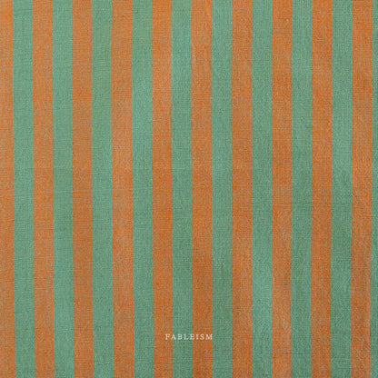 Fabric with green and orange vertical stripes, featuring the brand 'Fableism'.