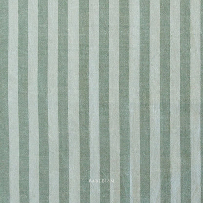 Fabric with vertical light teal and light brown stripes and 'Fableism' branding.