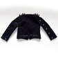 A black goth-style cropped jacket with silver and black studs and spikes, displayed flat against a white background.