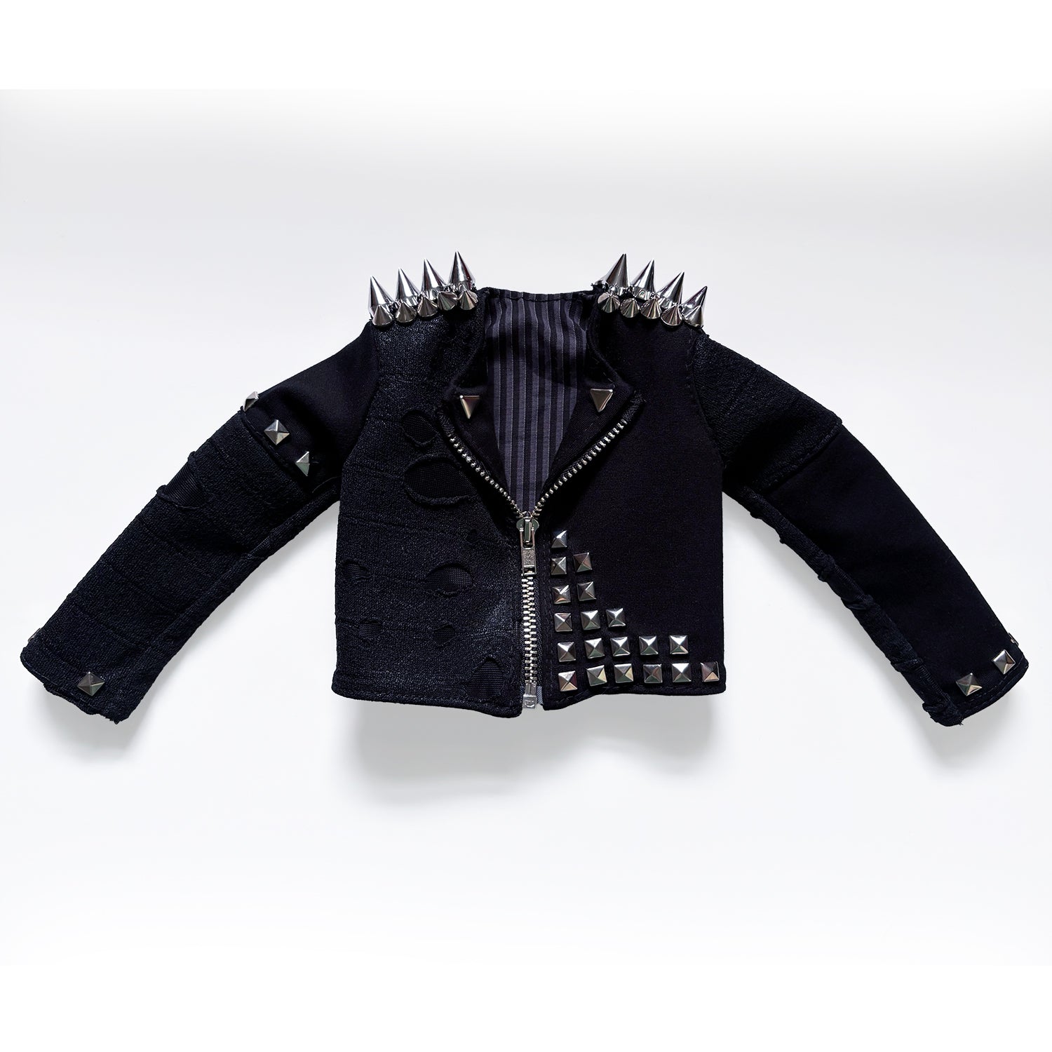 A black studded rock jacket with silver spikes on the shoulders and a striped lining, displayed on a clean white background.