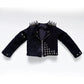 A black studded rock jacket with silver spikes on the shoulders and a striped lining, displayed on a clean white background.