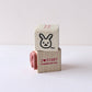 Two wooden blocks: one with a rabbit stamp and the second with 'I love stamp' text on a white background