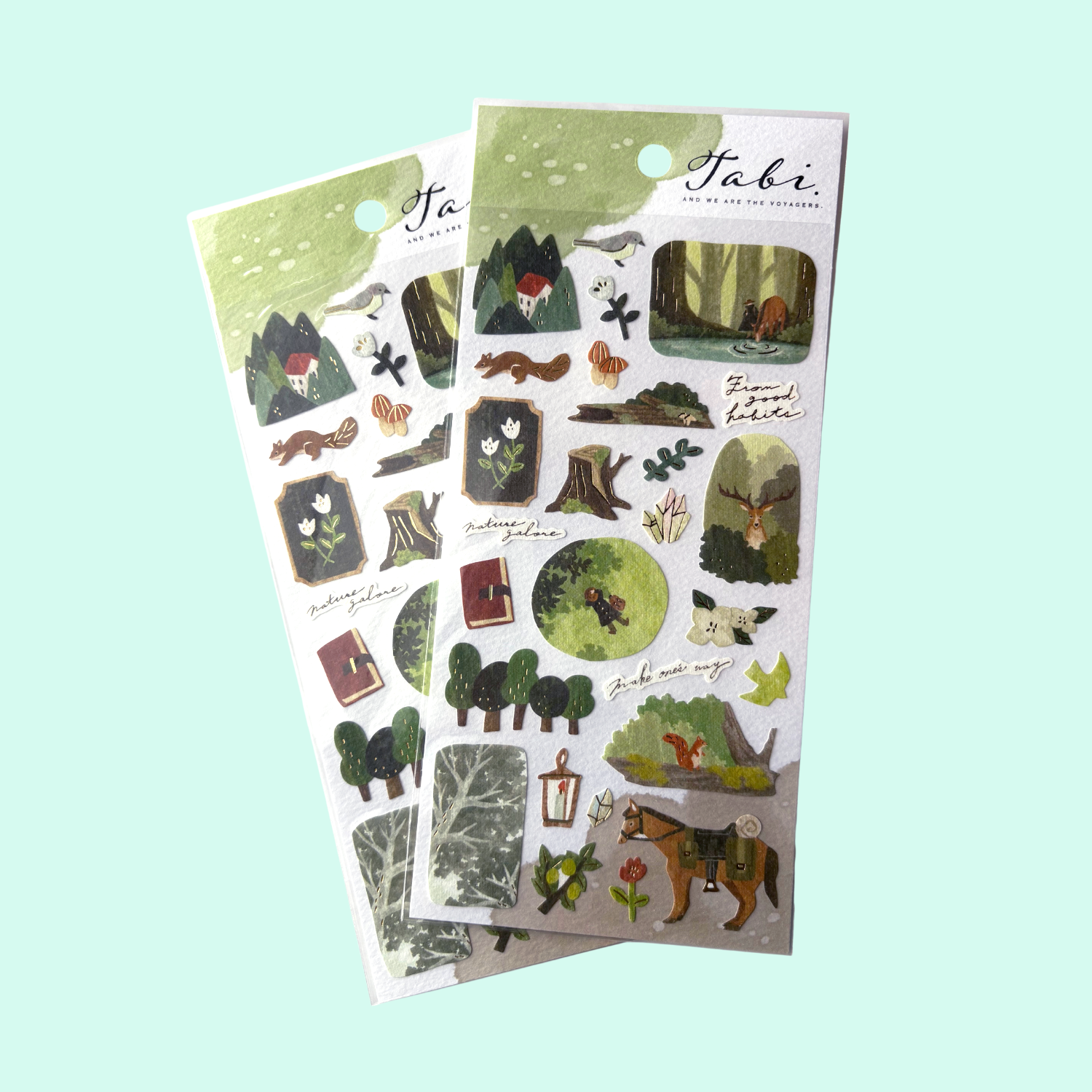 Two sheets of nature-themed stickers with 'Tabi' branding on a light blue background.