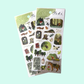 Two sheets of nature-themed stickers with 'Tabi' branding on a light blue background.