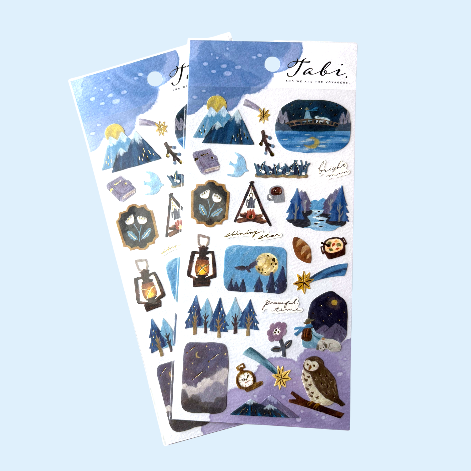 Sticker sheets with winter nature-themed designs on a light blue background