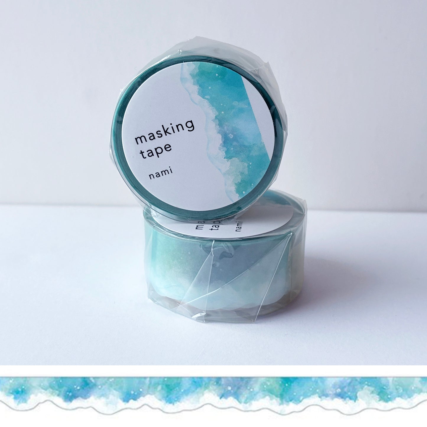 Roll of masking tape with an ocean wave design on a white background