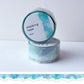 Roll of masking tape with an ocean wave design on a white background