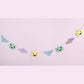 Paper garland decoration with pastel pumpkins and bats